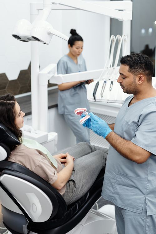 Dentist explaining care to a patient