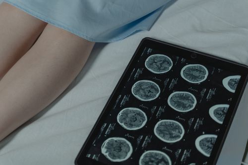 Patient speaking with a nurse in a hospital setting