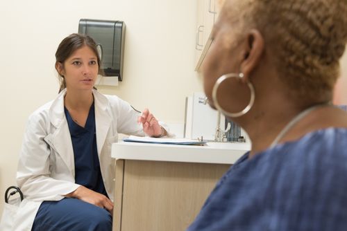A doctor listening attentively during a health consultation